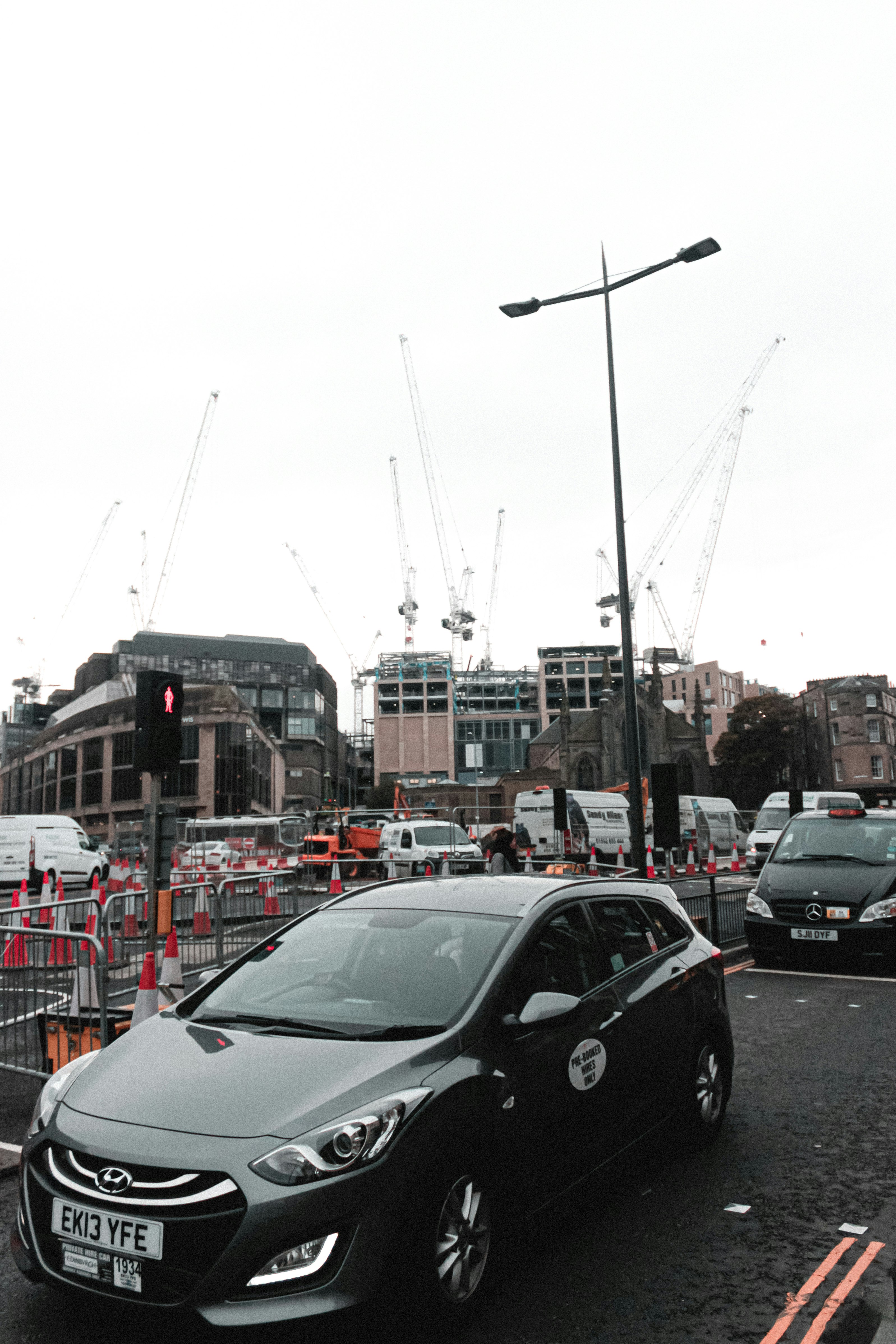 cars parked on side of the road during daytime